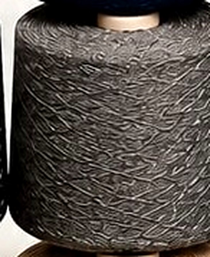 Grey Melange yarn cone showing consistent winding and count