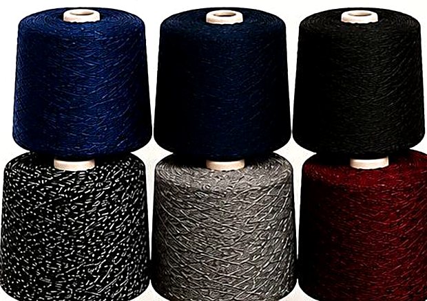 Stacked cones of premium OE yarn in six shades